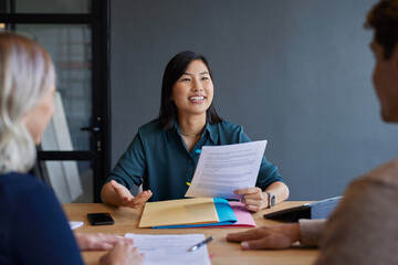 Advisor presenting documents in office