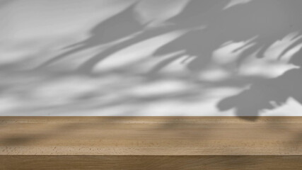 shadow of the trees gently swaying in the breeze, on a white background with a wooden table.