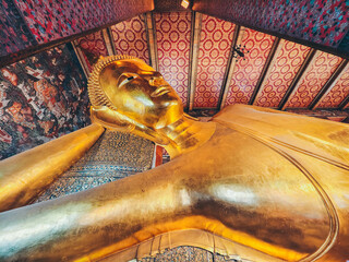 Wat Pho Temple. Lying Buddha statue Bangkok Thailand.