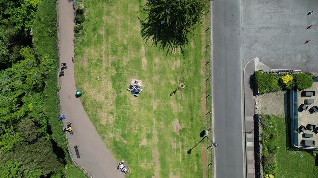 Babbacombe, Torbay, South Devon, England: DRONE VIEWS: Overhead view of Babbacombe Down, walkers and the nearby road. Babbacombe is a popular UK holiday destination (Clip 13).