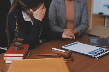 Judge gavel with Justice lawyers having team meeting at law firm background. Concepts of Law and...