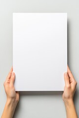 Blank paper held by hands (1)