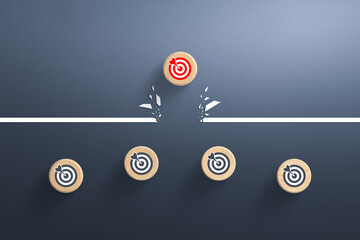 Target icon on wooden cube breaking through obstacle, Concept of overcoming barriers, goal