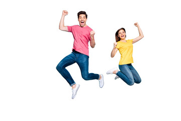 Full length body size view of his he her she nice crazy overjoyed cheerful couple jumping up in air...