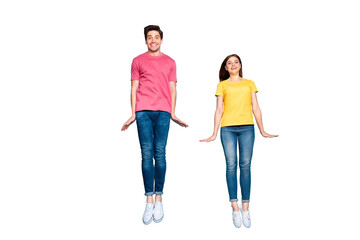 Fototapeta premium Full length body size view of nice attractive lovely cute funky cheerful cheery modest couple jumping in air having fun time isolated on bright vivid shine vibrant green turquoise background