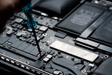 close up of Technician repairing electronic circuit board, repairing deteriorated battery, upgrade...