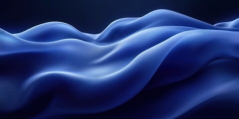 Obraz premium Smooth flowing fabric in deep blue tones with soft highlights creating wave-like folds and a serene, calming atmosphere