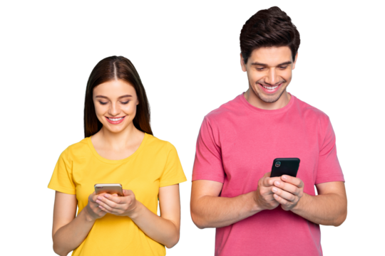 Portrait of his he her she nice attractive charming cute cheerful cheery focused couple using device gadget chatting online isolated over bright vivid shine vibrant green turquoise background