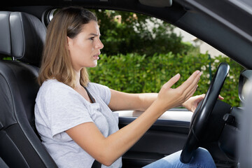 Naklejka premium angry woman driving a car