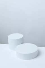 White podiums on a light background. Clean empty wall scene. Platforms vector geometric design