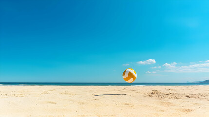 Obraz premium Yellow And White Volleyball In Flight Over Empty Beach On Sunny Day