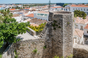 Wall and octagonal albarrã tower of the castle and architecture of Tavira, PORTUGAL