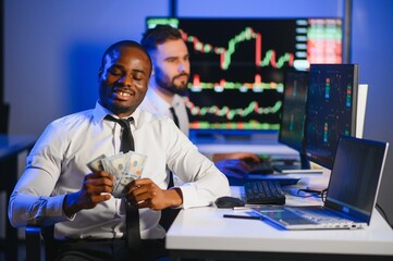 Holding Dollar bills in the stock market. Investor counting money after making it big on the stock market