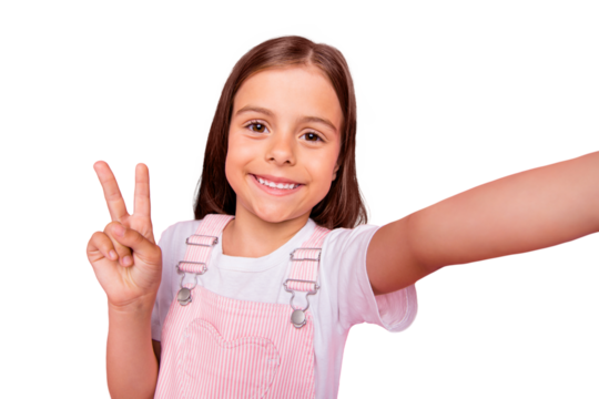 Closeup photo of little pretty lady make take selfies v-sign symbol say hi hello friends wear overall isolated pink background