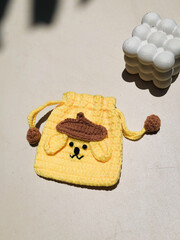Yellow Crochet Dog Character Pouch with Drawstring - Handmade Accessory in Bright Sunlight