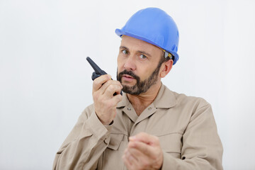 construction worker checking blueprint on site