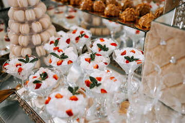 Delicious desserts featuring strawberries and mint at an elegant event setting