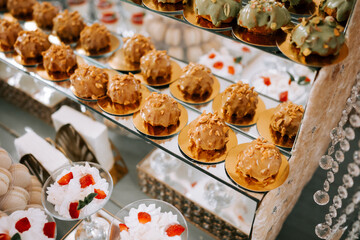 Delicious assortment of desserts on a display stand at a festive event