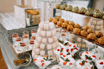 Elegant dessert display showcasing macarons and fruit parfaits at a luxurious event