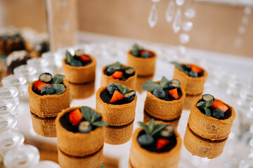 Delicious mini desserts arranged beautifully for a festive celebration in a decorative setting