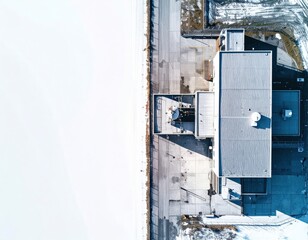 Aerial view of modern industrial structure surrounded by snow