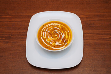 chicken korma in white plate. Delicious freshly prepared meal, perfect for menus, restaurants, or food delivery concepts.