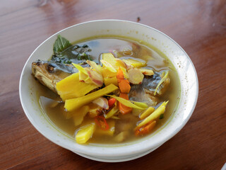 Pindang Patin on wooden table. Palembang specialties, South Sumatra