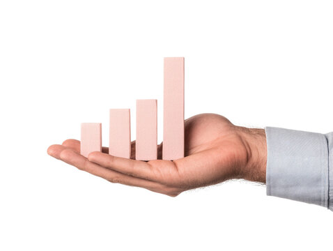 Hand holding pink bar chart with increasing growth concept on transparency background