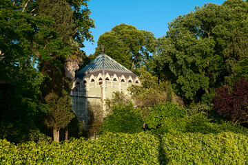 Hidden Garden Pavilion with Gothic Roof Surrounded by Lush Greenery in Venice – Enchanting Nature and Architecture Scene in Late Afternoon Light Perfect for Travel and Landscape Photography Enthusiast