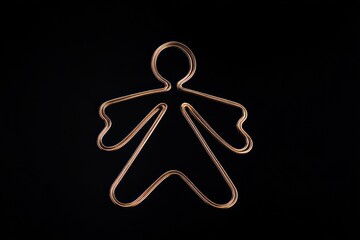 Obraz premium Copper Hanger Wire in Shape of Angel on Black Background, Simple Design in Minimalist Style, Product Photography