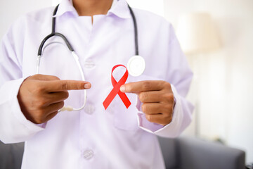 Doctor with Red Ribbon for March Multiple Myeloma Cancer and December World Aids Day Awareness...