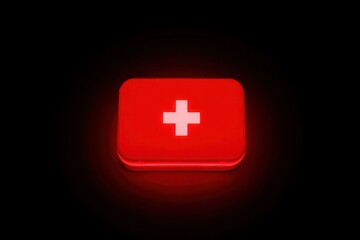 Fototapeta premium Glowing red first aid kit emergency medical box