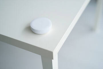 Minimalist White Smart Device on Table