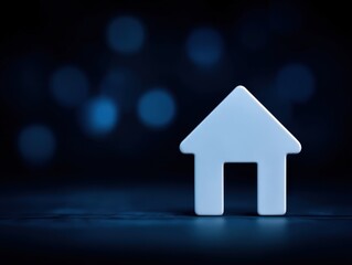 Minimalist house icon reflecting ideas of security stability and comfort set against a soft blue blurred backdrop creating a serene and modern visual experience for home representation