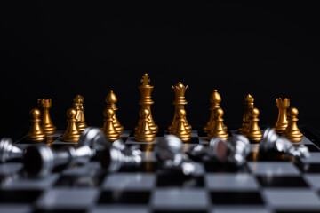 The set of golden chess pieces element, king, queen rook, bishop, knight, pawn standing on...