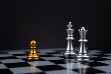 Leader, business strategy and planning concept, Golden pawn and silver chess king and queen figure on chessboard