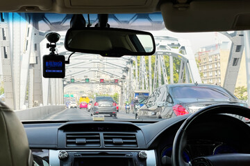View from inside of the car show traffic ahead while driving across the bridge on the road of Bangkok Thailand.Image use for holiday travel presentation background.
