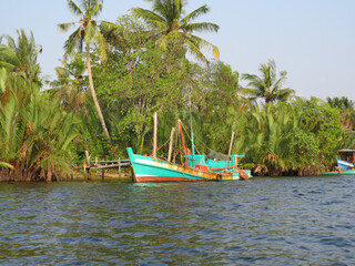 Fishing boat in the jungle on the Praek Tuek Chhu River in Kampot