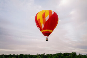 Brightly colored hot air balloon rises gracefully