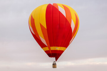 Brightly colored hot air balloon rises gracefully