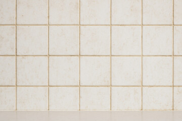 Tile Detail: A close-up shot of a grid of square tiles, highlighting the patterns, lines and textures. A simple, yet compelling graphic element suitable for a variety of design application.