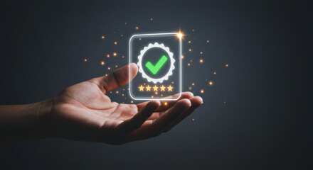 Persons hand holding a glowing green checkmark with five gold stars.