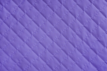 Obraz premium Checkered, diamond stitching pattern, purple quilted fabric background. Blanket or puffer jacket, stitch rhombus texture close up, macro. Wallpaper, backdrop.