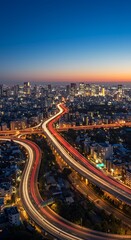 Fototapeta premium Cityscape at night with glowing lights and highway