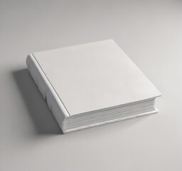 Fototapeta premium Clean white book on textured surface, square format, background, empty, square