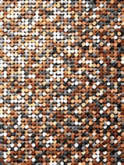 Fototapeta premium Close-up of a copper discs composition with repetitive arrangement background 
