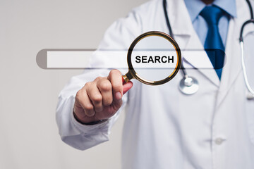 Doctor holding magnifying glass over search bar concept for medical research and health data.