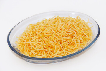 PORTION OF STRAW POTATOES IN A GLASS BOWL