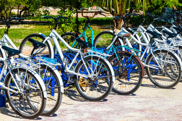 Bicycle Bicycles bike bikes parked at the beach entrance Mexico.