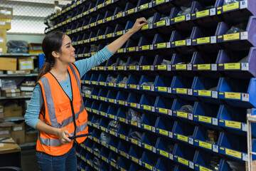 happy woman worker engineer technician staff work in factory products parts inventory warehouse storage